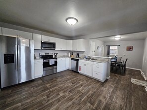 The kitchen is large and open- but the kids (whether they have 2 or 4 legs) will still find a way to get under foot!