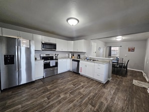 The kitchen is large and open- but the kids (whether they have 2 or 4 legs) will still find a way to get under foot!
