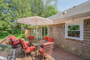 Enjoy seamless outdoor living with this generous deck located just off the kitchen. Equipped with plenty of comfortable seating,