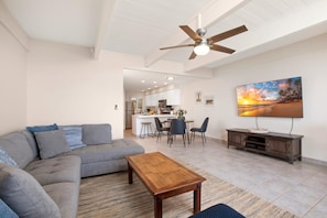 LOK-B201 Spacious and simple, this open-plan retreat features plush seating, beachy hues, and room to gather or sprawl