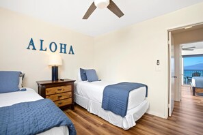 LOK-B201 Say ?Aloha? to restful charm?twin beds, ocean blues, and sunny vibes come together in this cozy island escape   : Master Bedroom