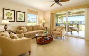 HLI-12A Open, airy living room with calming hues and seamless access to the outdoor lanai