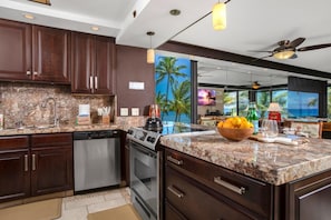 MAH-301 This kitchen gleams like a well-polished secret, where stainless steel appliances flirt with rich cherrywood charm
