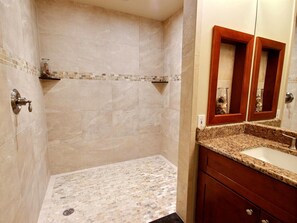 KGV-19P3 From mirror to marble and rain to refresh, this guest bath offers a quiet pause between beach walks and sunset views
