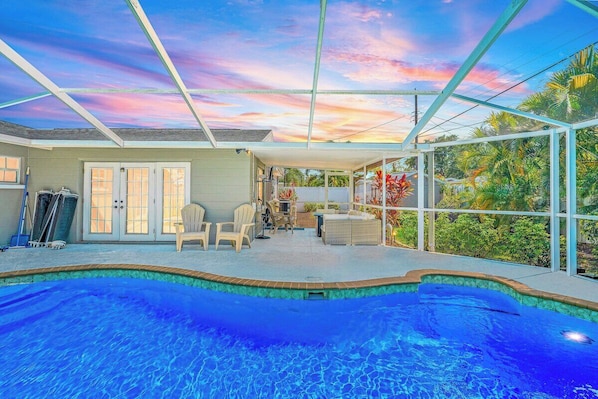 Take a splash in our luxurious covered pool with fire pit and hot tub...