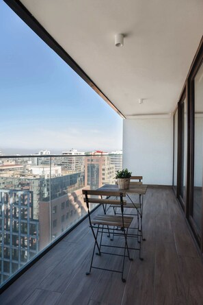 Enjoy breathtaking city views from your private balcony, perfect for a morning coffee or evening relaxation.