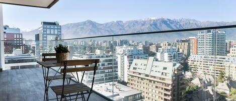 Enjoy breathtaking city and mountain views from your private balcony, perfect for a morning coffee or evening relaxation.