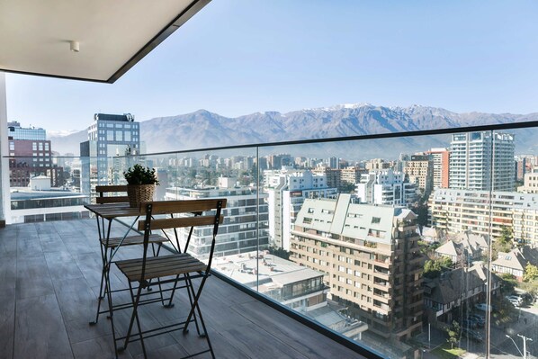 Enjoy breathtaking city and mountain views from your private balcony, perfect for a morning coffee or evening relaxation.
