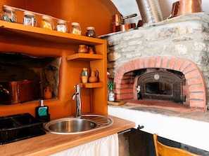 Interior Design, Orange, Kitchen, Kitchen Appliance, Room, Countertop, Hearth, Stove, Chimney, Fireplace