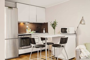 Enjoy home-cooked meals in this stylish kitchen with modern appliances.
