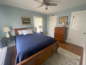 Bedroom #1 - Queen bed with dresser and closet.