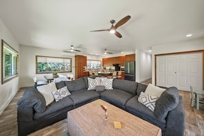 Spacious open-concept living room with sectional seating—perfect for unwinding after a North Shore day.