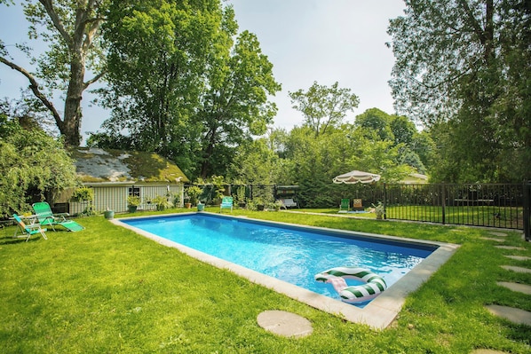 A serene escape - our private pool with lush fenced in yard.