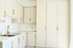 Lough Conn Haven Holiday Home. Modern open plan kitchen storage.