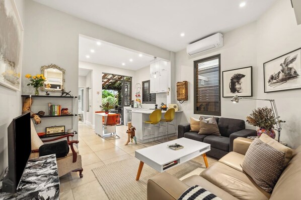 Enjoy the seamless flow from the living area to the kitchen and dining areas—ideal for casual gatherings with ease.