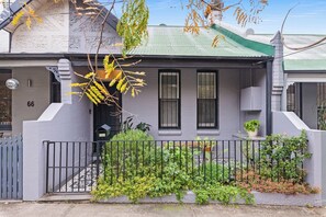 Arrive at the charming façade with leafy curb appeal and your private entrance—an inviting welcome to your stay in Newtown.