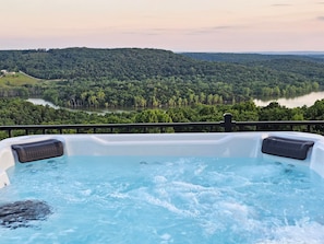 Unwind in the private hot tub overlooking Table Rock Lake and the stunning Ozark Mountains. This Branson family vacation home offers unforgettable views and peaceful sunsets, just minutes from top Branson, MO attractions and lake adventures!