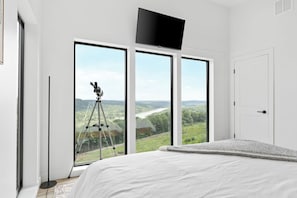 Wake up to sweeping views of Forest Lake and the Ozark Mountains. Perfect for a peaceful holiday getaway in Branson, MO. Enjoy stargazing with the in-room telescope, morning coffee with a view, and easy access to top attractions, shows and lake adventures.