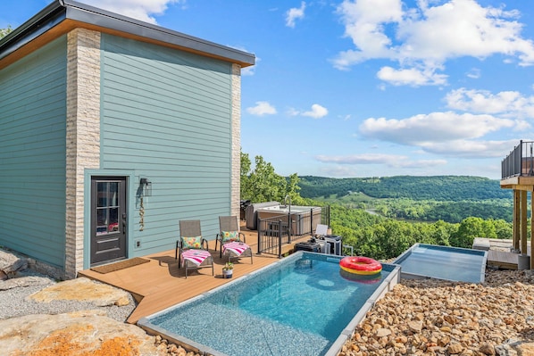 Soak up with the breathtaking Ozark Mountain views at this Branson vacation rental by Relax and Renew Rentals. Enjoy your private plunge pool, hot tub, and stylish patio seatingāperfect for relaxing after a day at Silver Dollar City or Table Rock Lake!