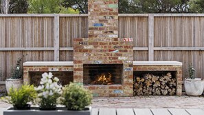 Settle in around the outdoor fireplace for a cosy evening with the family, think toasted marshmallows