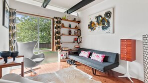 Welcome to our mid-century modern retreat, where retro charm meets contemporary comfort. 
