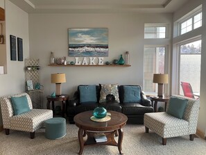 Main Floor Living Room with access to lakefront full length deck. 