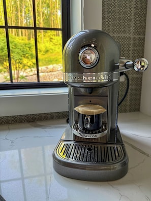 Sip rich espresso with nature views—all from the comfort of your stay. ☕️