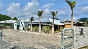 Go through the inn gate and follow the road to the right for one minute to reach the entrance to Pandanus.