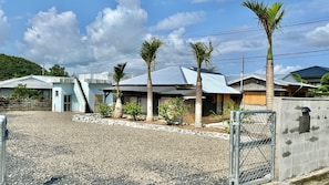 Go through the inn gate and follow the road to the right for one minute to reach the entrance to Pandanus.