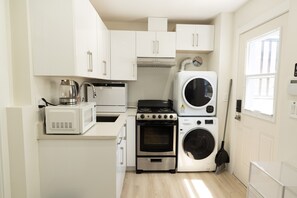 Bright and clean kitchen set up for your basic cooking needs.