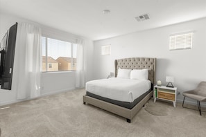 Stretch out and settle in—our spacious queen bedrooms offer the perfect mix of comfort and calm. Soft linens, cozy touches, and room to truly relax.