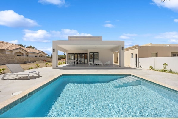 Your private slice of paradise—just steps from the pool to pure relaxation. Perfect spot to soak up the sun and enjoy island life at its finest.
