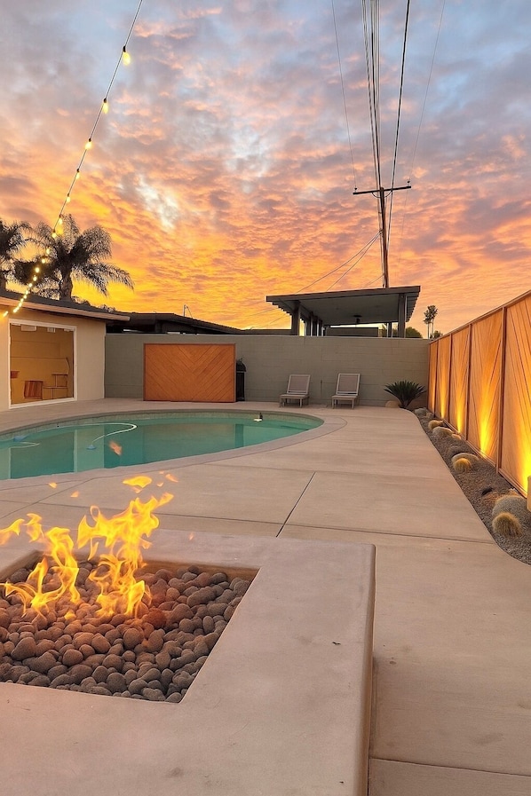 Pool, gas firepit with sectional seating, sun loungers