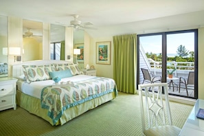 Primary Bedroom features a king bed and private balcony.