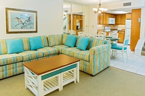 Spacious living room features a queen sleeper sofa.