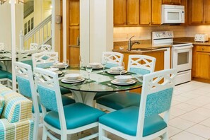 Separate dining area with large table.