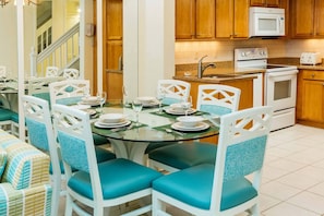 Separate dining area with large table.