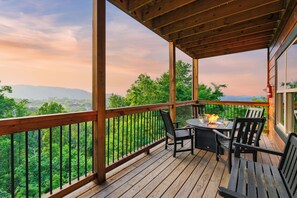 Fire table with seating on the balcony and stunning mountain views.
