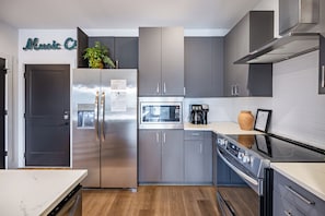 Sleek modern kitchen with stainless steel appliances.