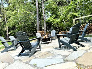 Flagstone fire pit area with wood