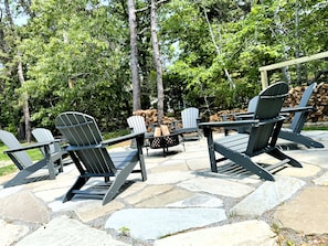 Flagstone fire pit area with wood