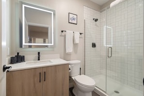 You feel a sense of calm as you enter the bathroom, where the thoughtful design and high-quality materials create a serene environment.