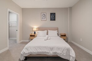 The bedroom’s serene ambiance invites you to relax, with a plush bed that promises a restful night's sleep.