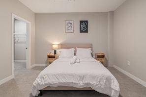 The bedroom’s serene ambiance invites you to relax, with a plush bed that promises a restful night's sleep.