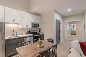 You’ll love the convenience of this fully equipped kitchen, where you can brew coffee, cook meals, or prepare snacks. The cozy layout and warm ambiance make cooking here a delightful part of your stay.