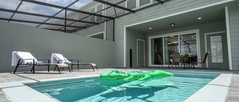 Unwind in our private screened patio oasis complete with a refreshing pool, sunny loungers and playful inflatable gator—your personal retreat after a day of adventures!