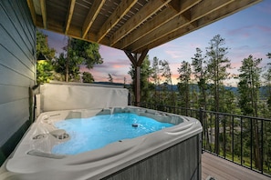 This is what peak relaxation looks like - soaking in the hot tub with gorgeous mountain views