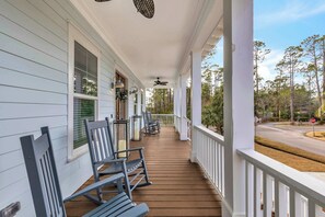 Sip morning coffee or an evening cocktail on the breezy front porch