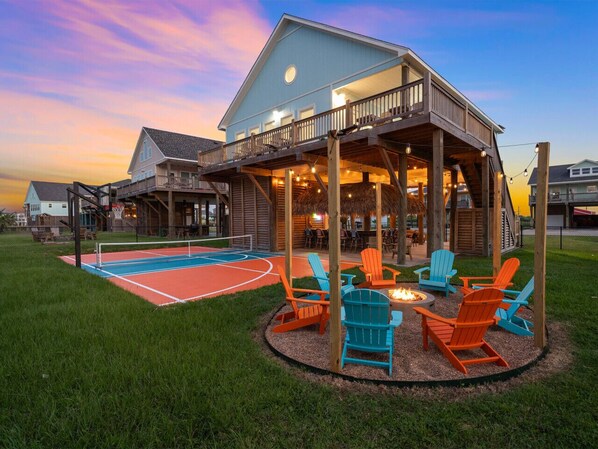 Serve. Sip. S’mores. Your own private pickleball court, tiki lounge, and firepit—just steps from the beach.
