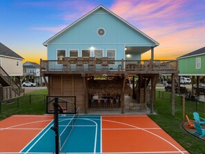 Your private resort: pickleball court, tiki bar, and firepit—just steps from your front door.